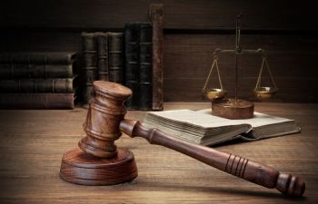 Judge Gavel, Scales of Justice and legal books on the desk