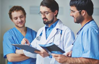 3 Doctors Discussing Medical Treatment